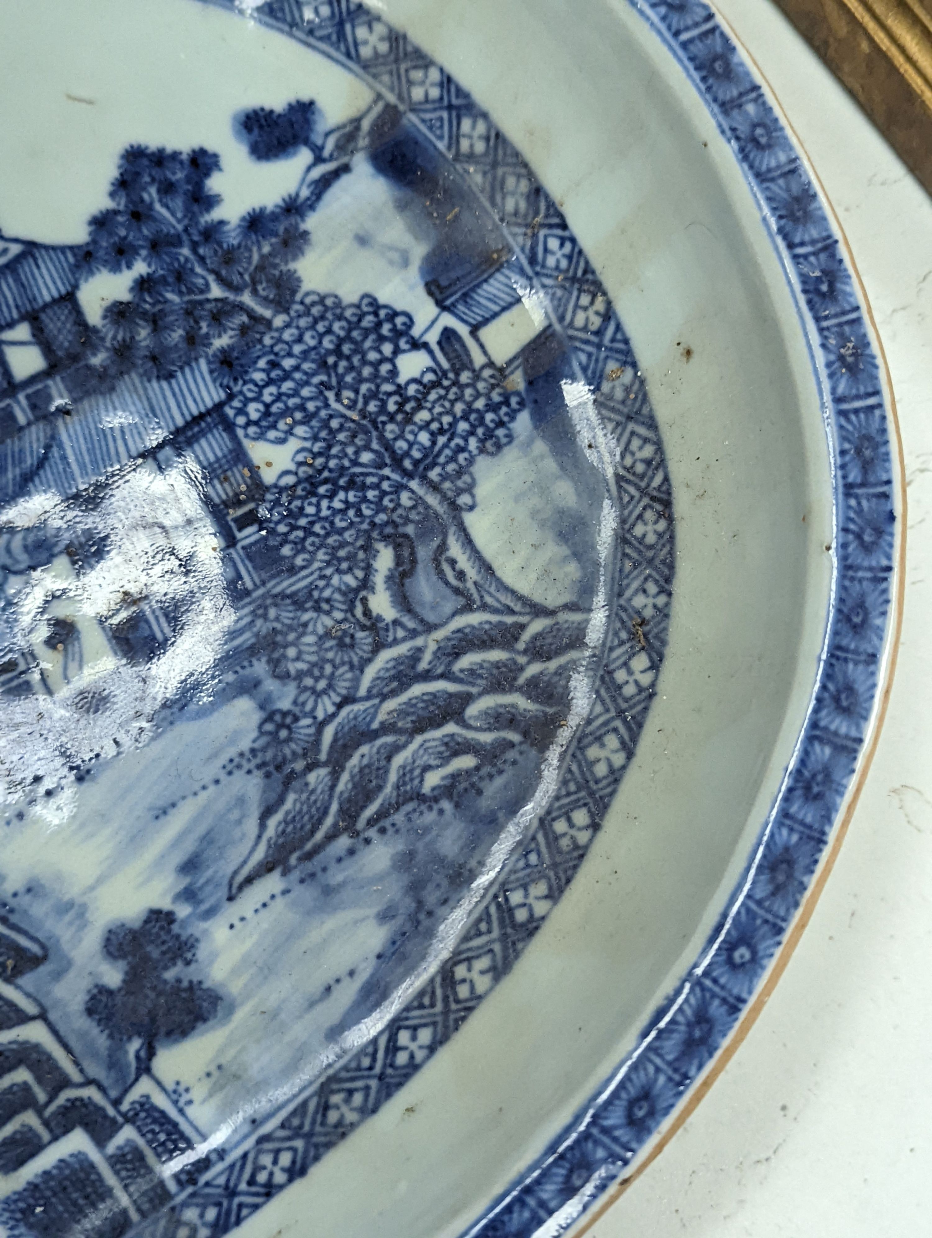 An 18th century Chinese export oval blue and white dish, 32cm.